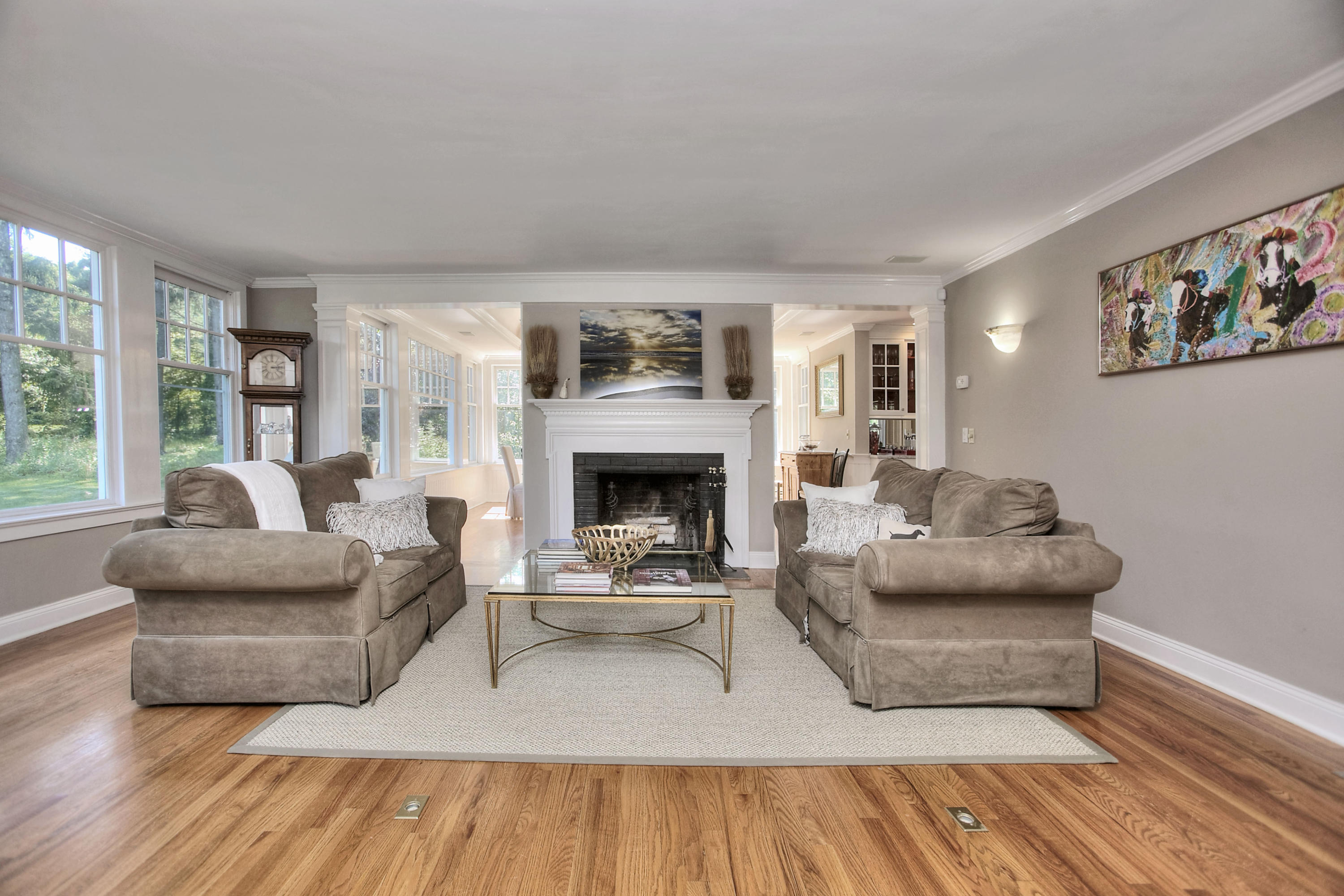 1335 Smith Ridge Road New Canaan, CT 06840 - Photo 3 of 42 a living room with furniture and a fireplace