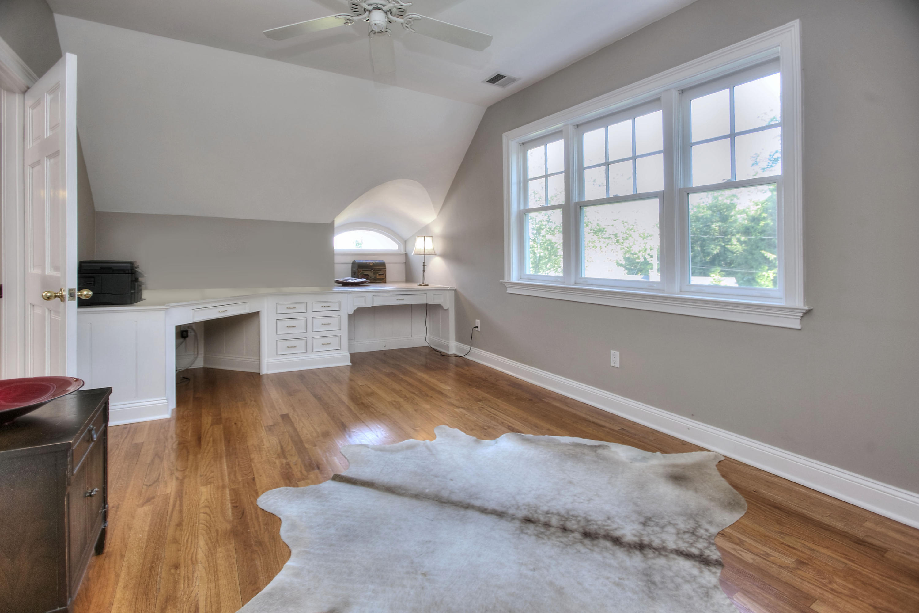 1335 Smith Ridge Road New Canaan, CT 06840 - Photo 32 of 42 an empty room with windows and fireplace