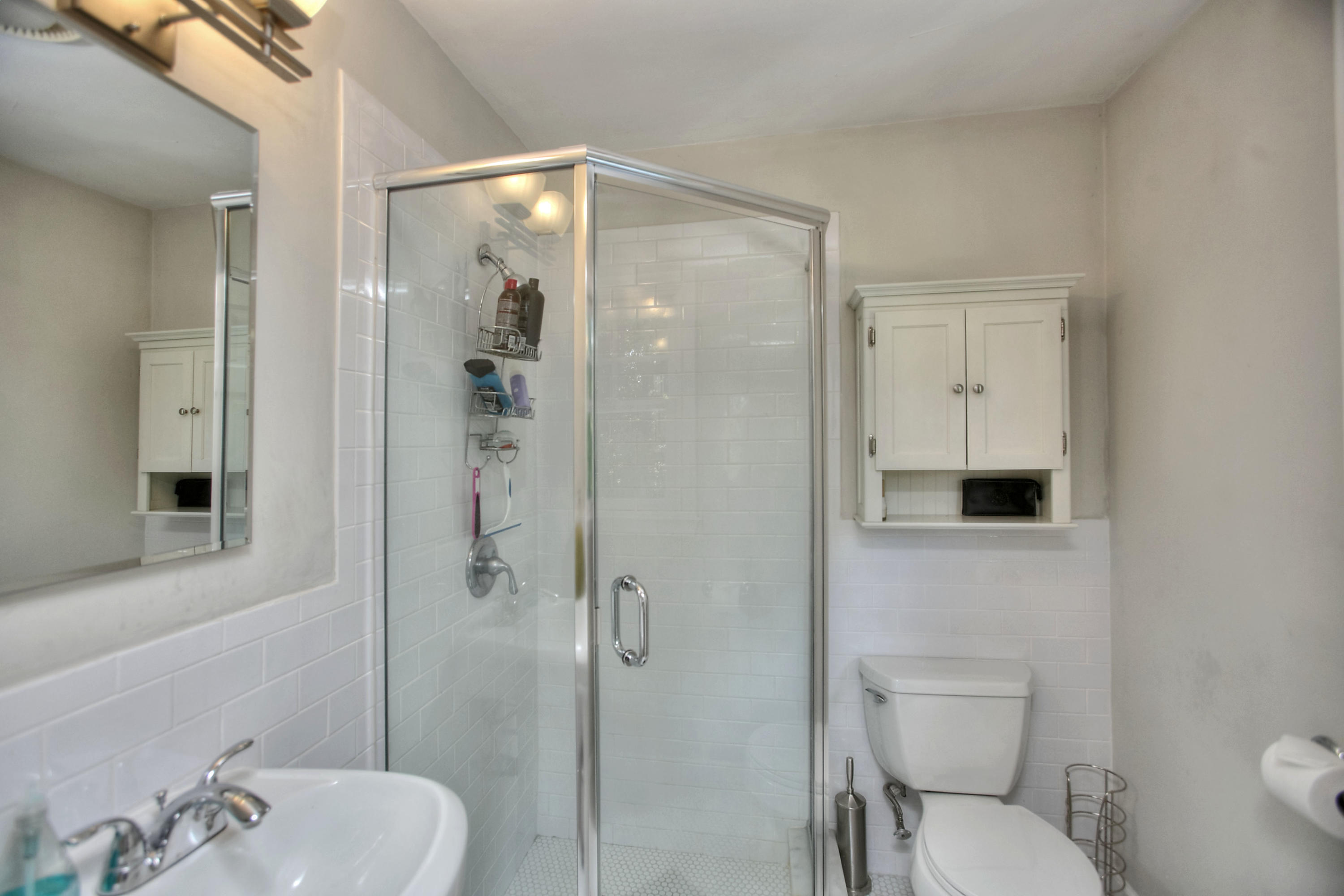 1335 Smith Ridge Road New Canaan, CT 06840 - Photo 36 of 42 a bathroom with a toilet a sink and shower