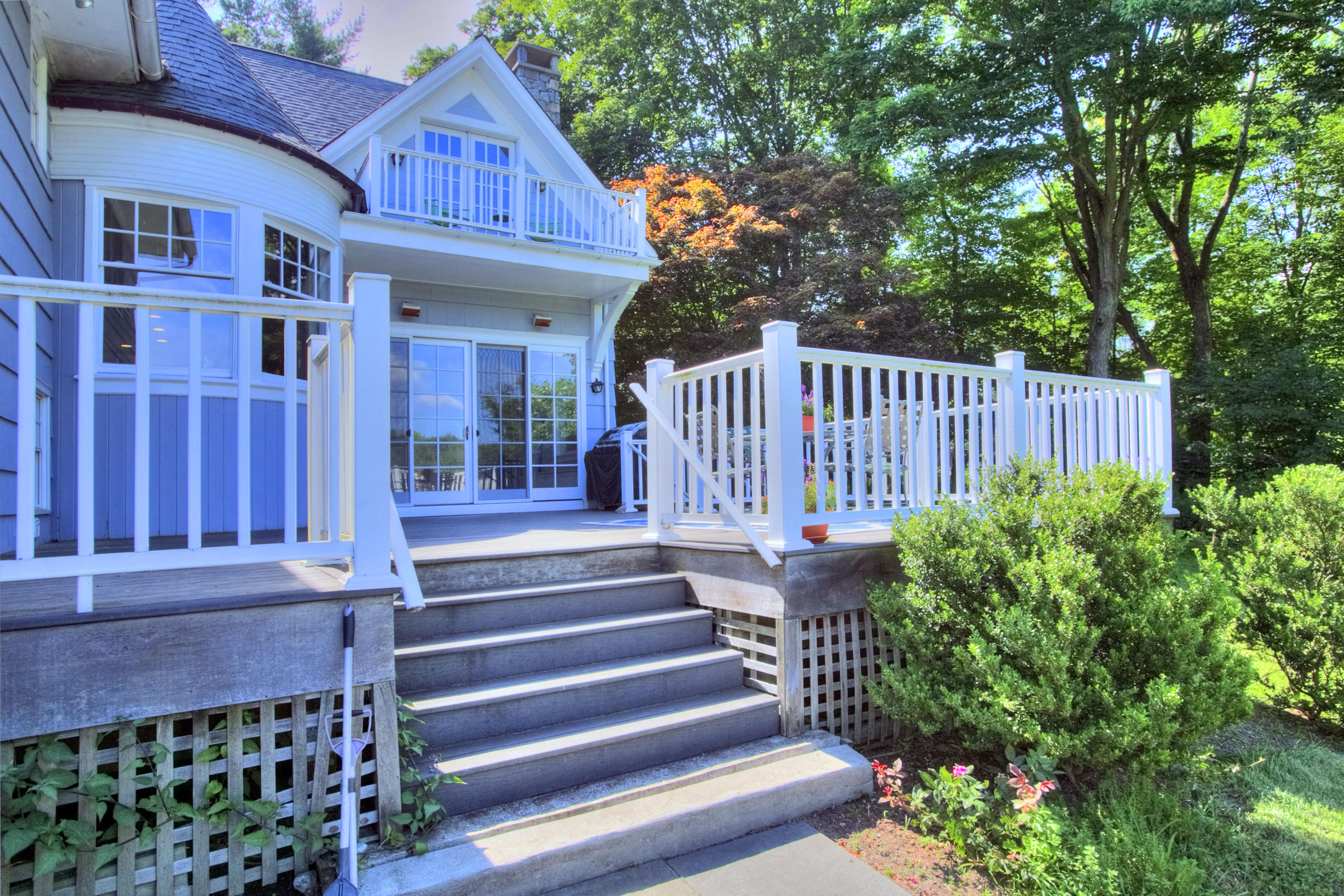 1335 Smith Ridge Road New Canaan, CT 06840 - Photo 40 of 42 a view of a house with a small yard plants and large trees