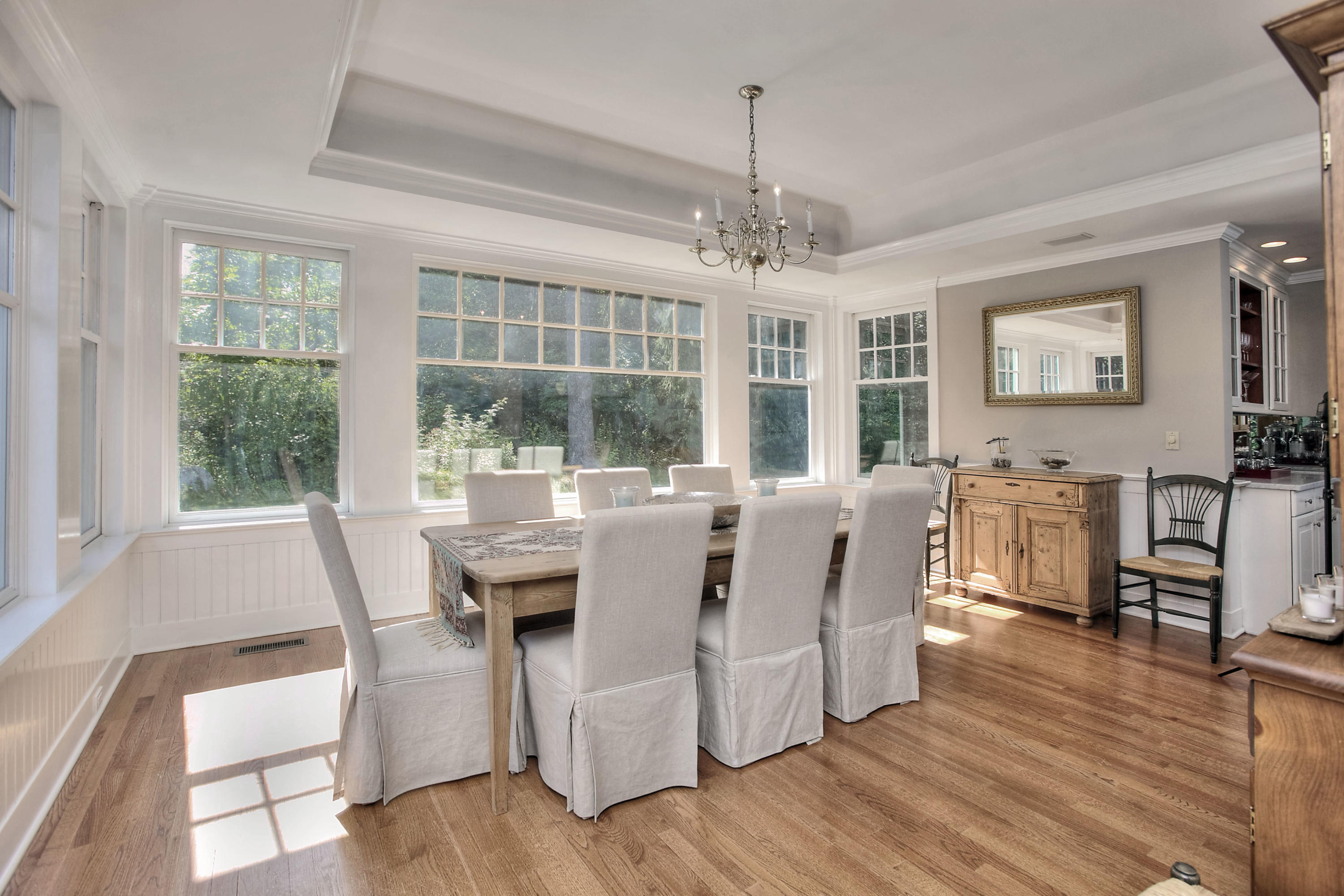1335 Smith Ridge Road New Canaan, CT 06840 - Photo 5 of 42 a view of a dining room with furniture window and wooden floor