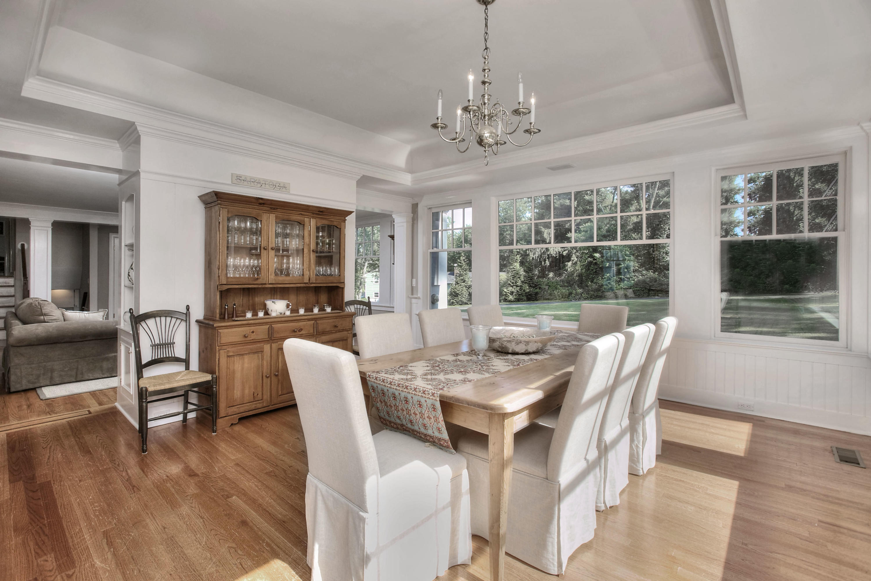 1335 Smith Ridge Road New Canaan, CT 06840 - Photo 6 of 42 a view of a dining room with furniture window and wooden floor