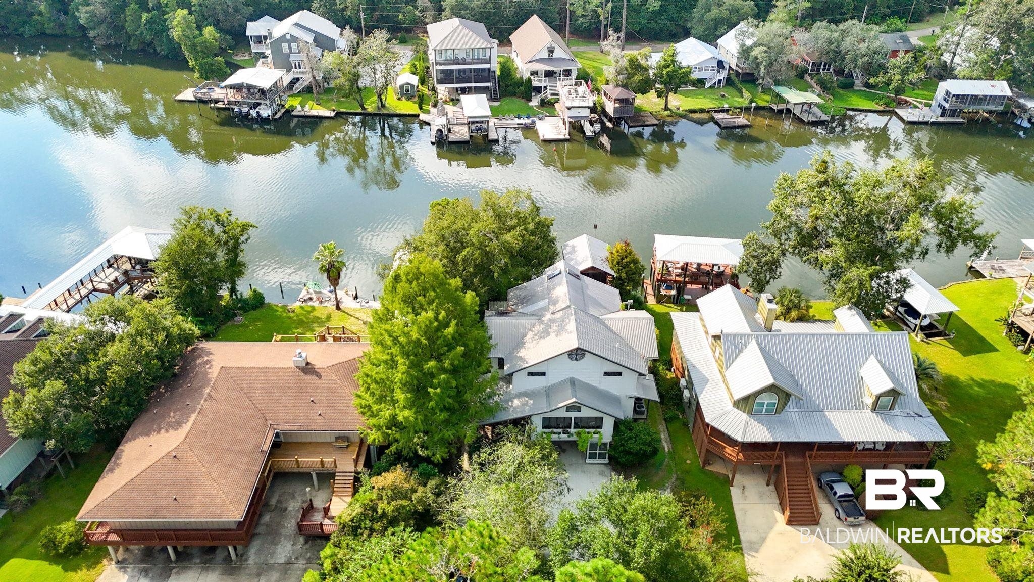 16451 Honey Road Summerdale, AL 36580 - Photo 53 of 55 Aerial perspective of suburban area with a nearby body of water