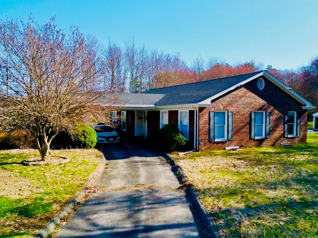 a front view of a house with yard