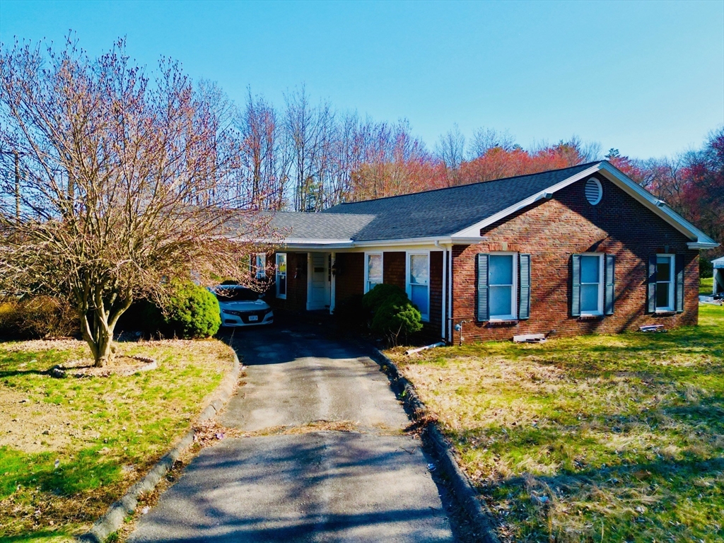 a front view of a house with yard