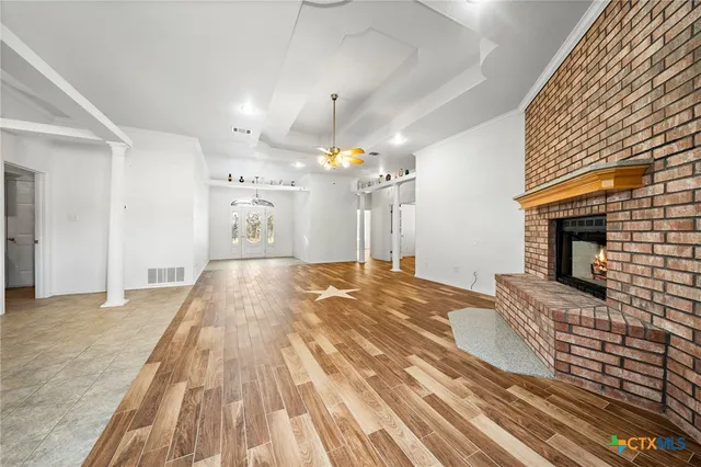 a spacious bedroom with a bed and a fireplace