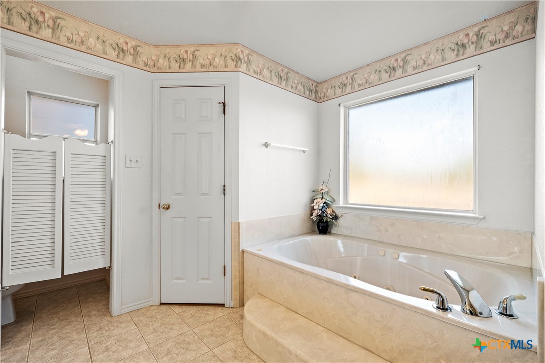 853 County Road 4390 Kempner, TX 76539 - Photo 33 of 43 a bathroom with a tub and a sink