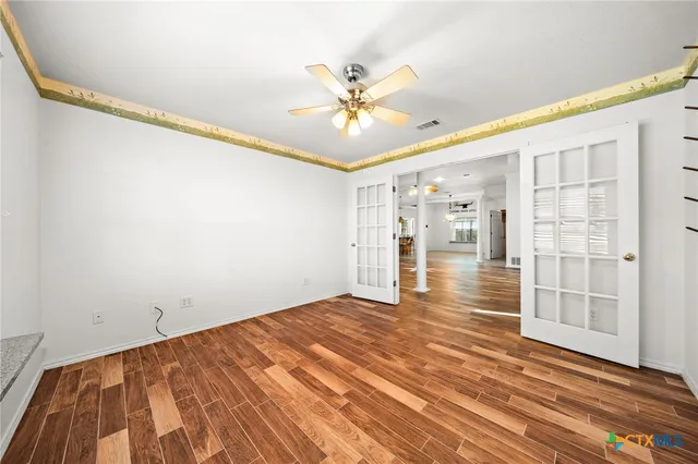 a view of an empty room with a window