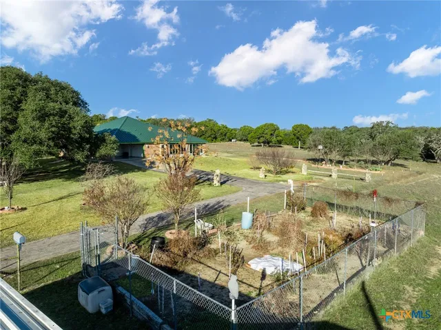 a view of kitchen with furniture and chandelier