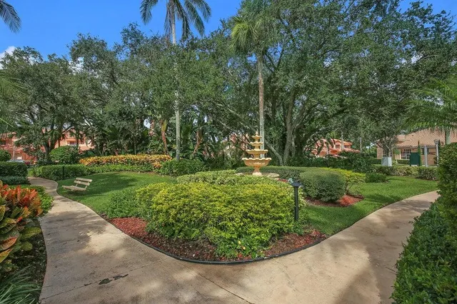 a view of a garden with a fountain