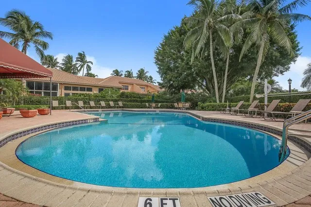 a view of a swimming pool with a patio