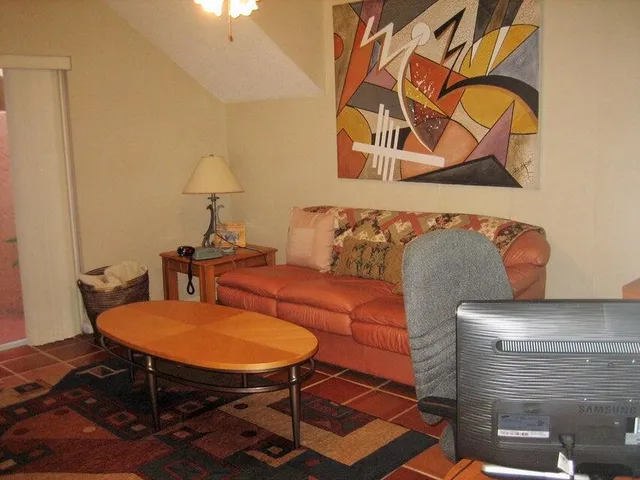 a living room with a couch and a table