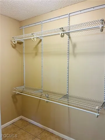 a bathroom with a shower and a glass door