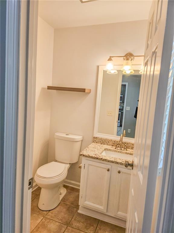 131 Willow Stream Court Roswell, GA 30076 - Photo 14 of 25 a white toilet sitting next to a bathroom sink