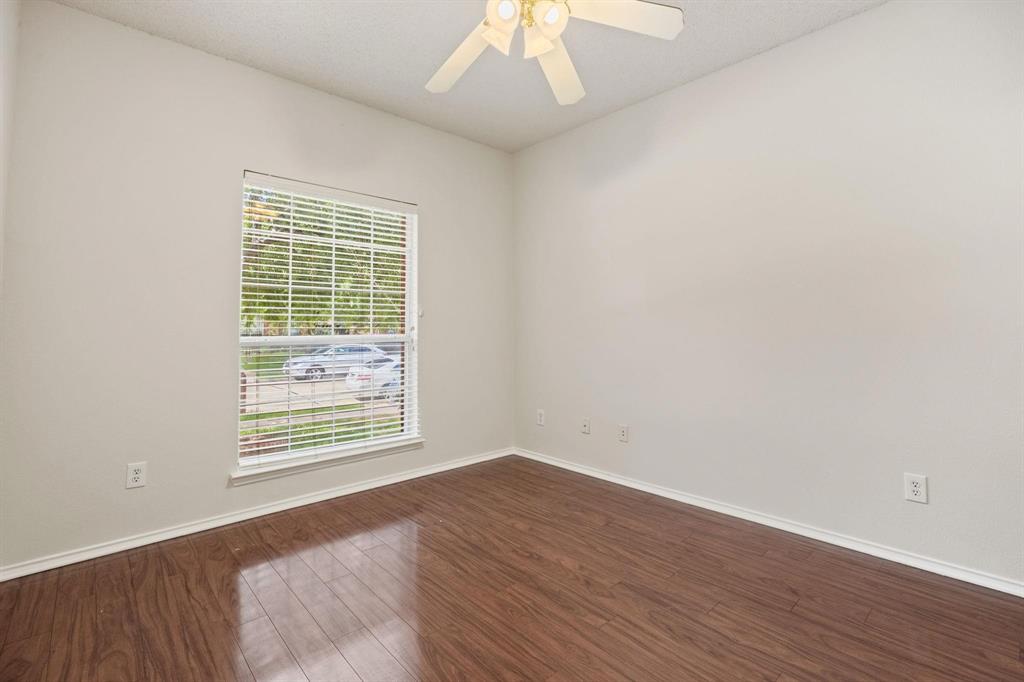 433 Spring Air Drive Allen, TX 75002 - Photo 24 of 27 an empty room with wooden floor and windows