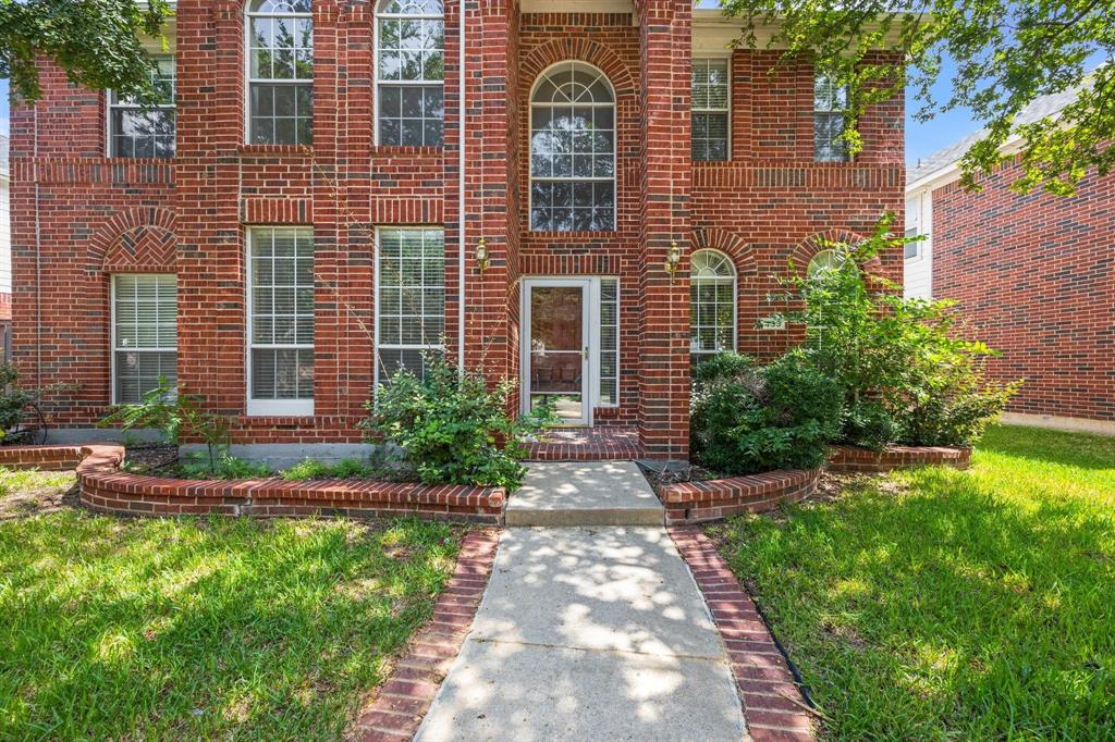 433 Spring Air Drive Allen, TX 75002 - Photo 3 of 27 a front view of a house with garden