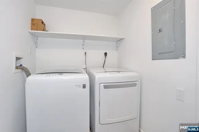 a view of storage and utility room with racks on the wall