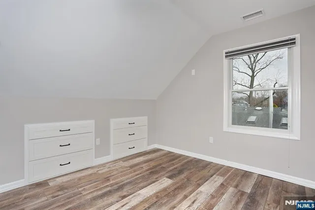 a view of a bedroom with baby bed