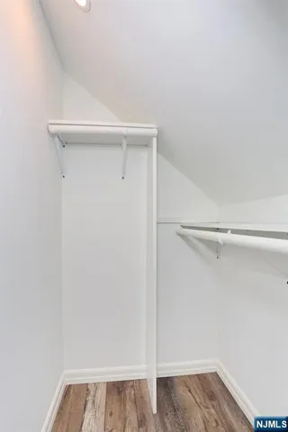 a bathroom with a sink mirror vanity and toilet