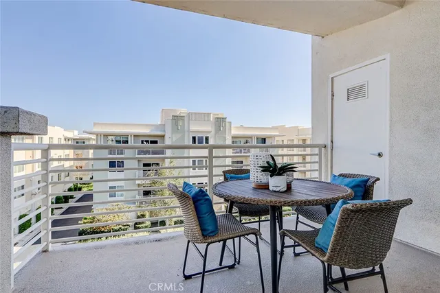 a view of a dining room with furniture and a window