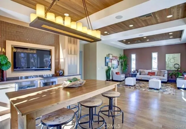 a living room with granite countertop lots of furniture and a fireplace