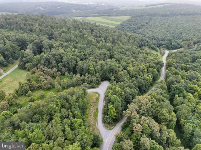 an aerial view of residential house with outdoor space