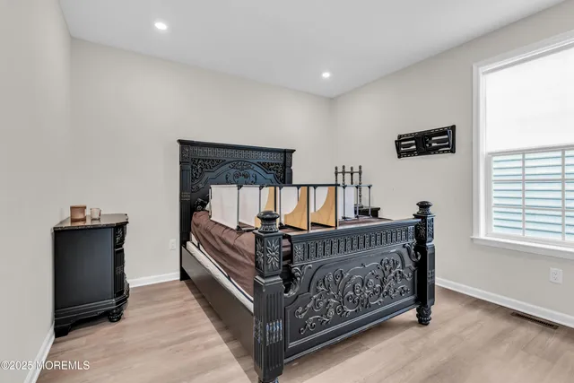 a bed room with a bed and a window