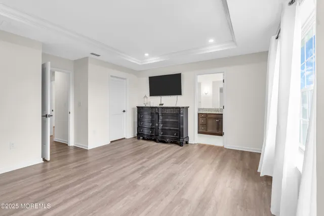 a view of a livingroom with a flat screen tv and fireplace