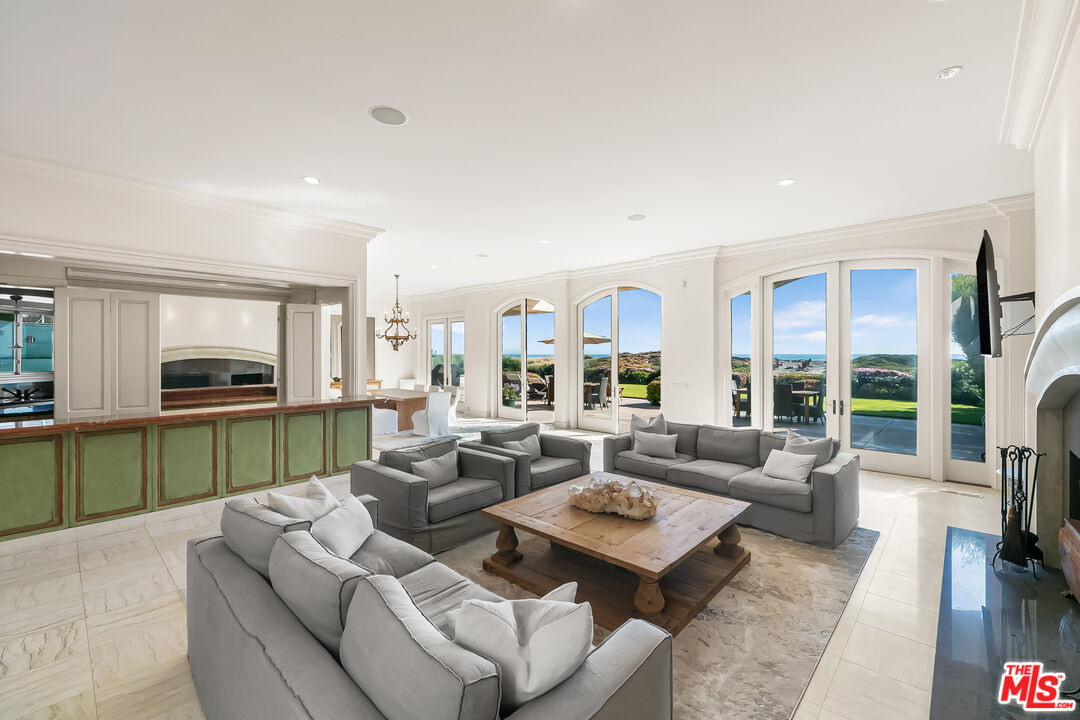 0 Broad Beach Road Malibu, CA 90265 - Photo 6 of 54 a living room with furniture kitchen view and a large window