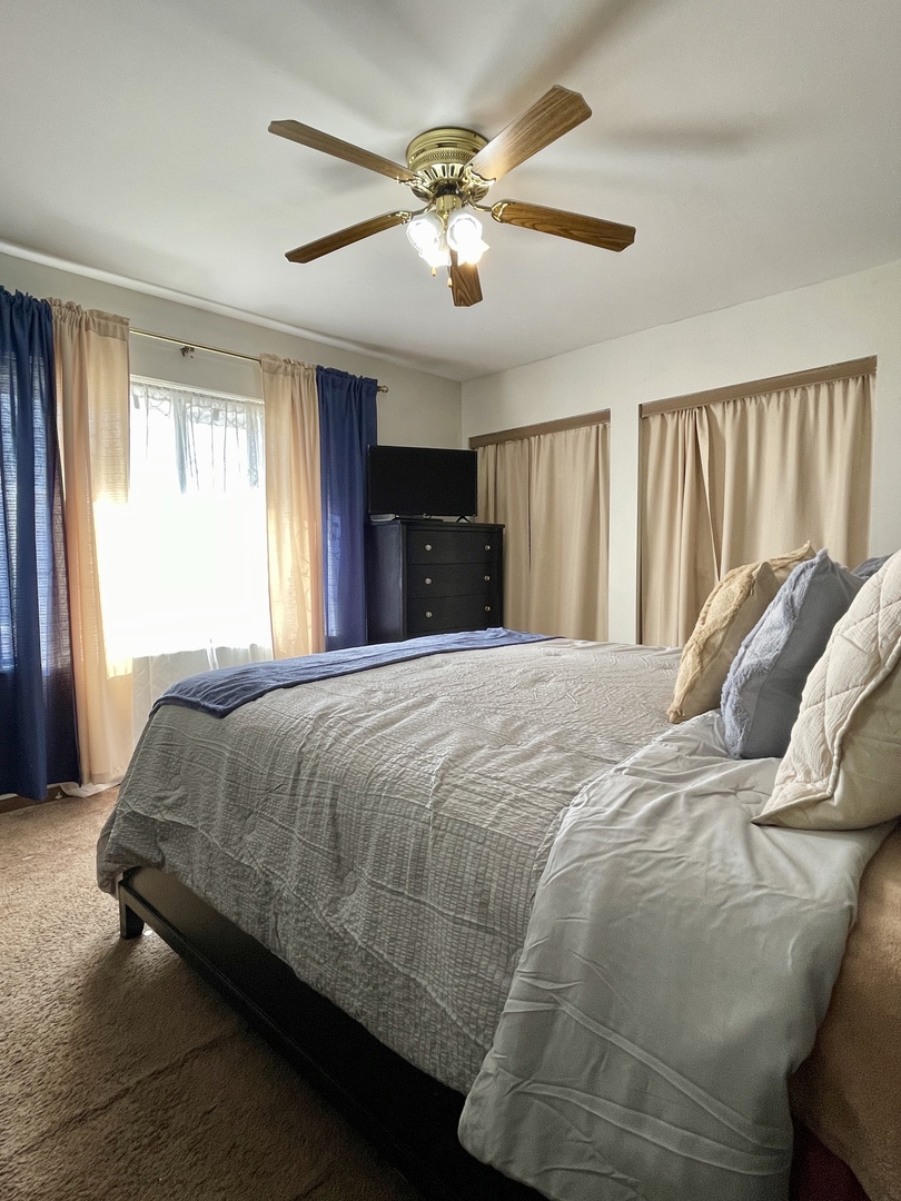 3406 Seine Court Hazel Crest, IL 60429 - Photo 15 of 26 a bed sitting in a bedroom next to a window