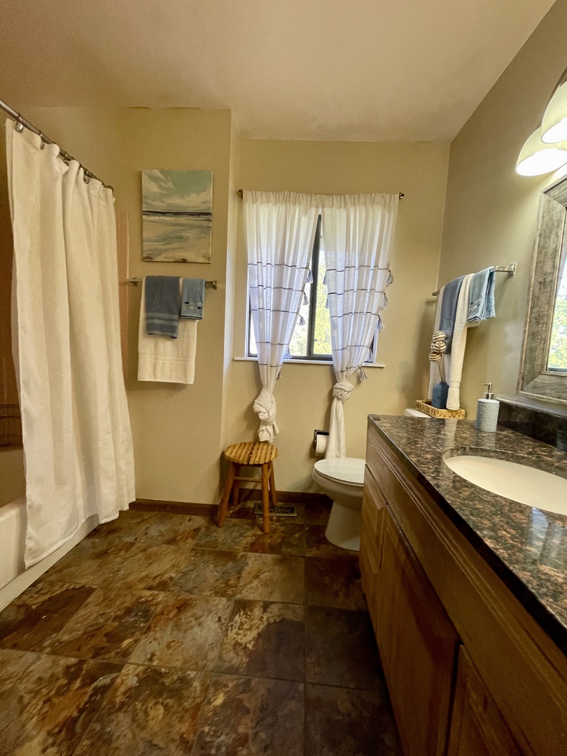 3406 Seine Court Hazel Crest, IL 60429 - Photo 22 of 26 a spacious bathroom with a granite countertop sink and a mirror