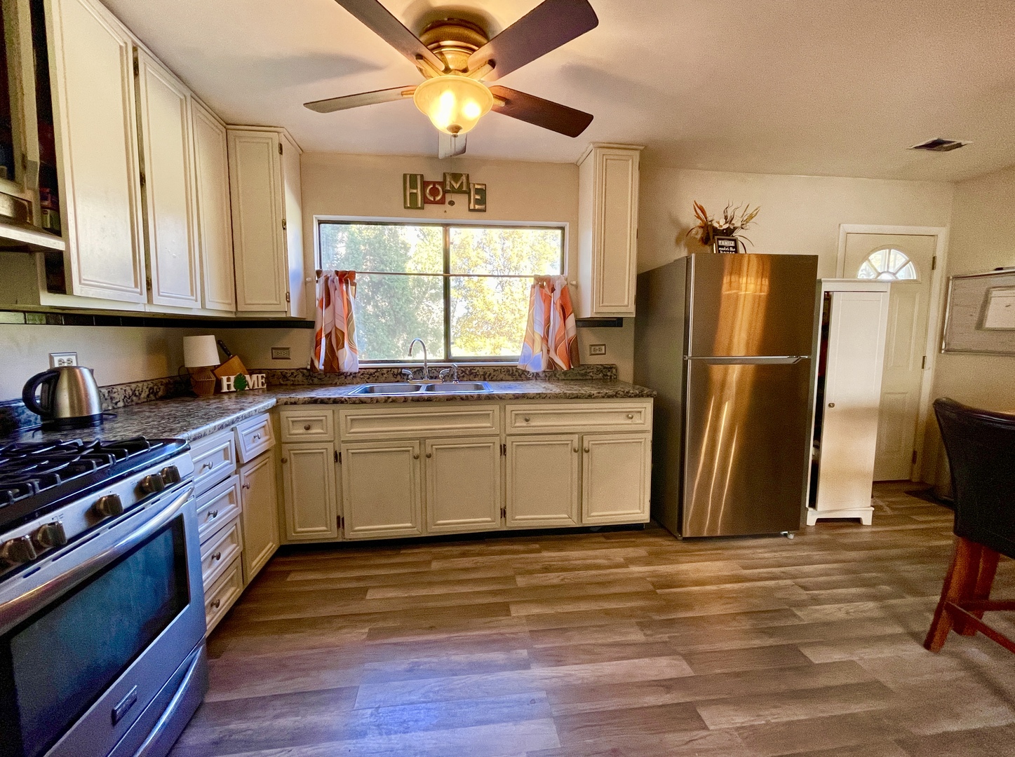 3406 Seine Court Hazel Crest, IL 60429 - Photo 4 of 26 a kitchen with stainless steel appliances a stove a refrigerator and a sink