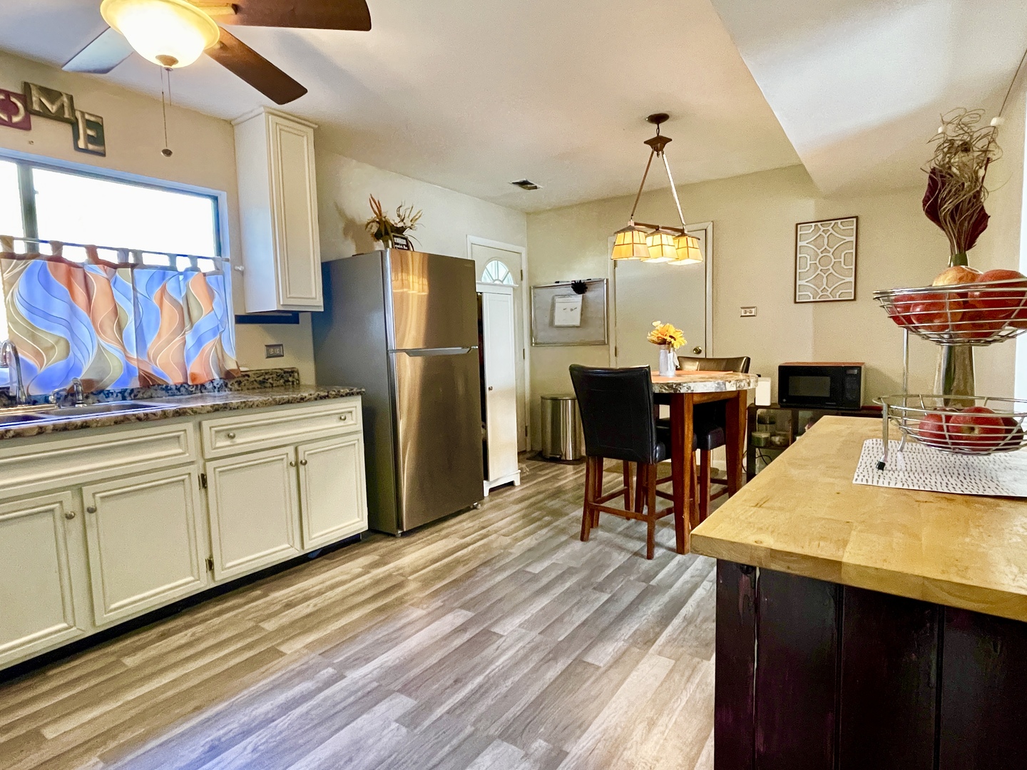 3406 Seine Court Hazel Crest, IL 60429 - Photo 6 of 26 a kitchen with stainless steel appliances granite countertop a sink dishwasher and a refrigerator with wooden floor