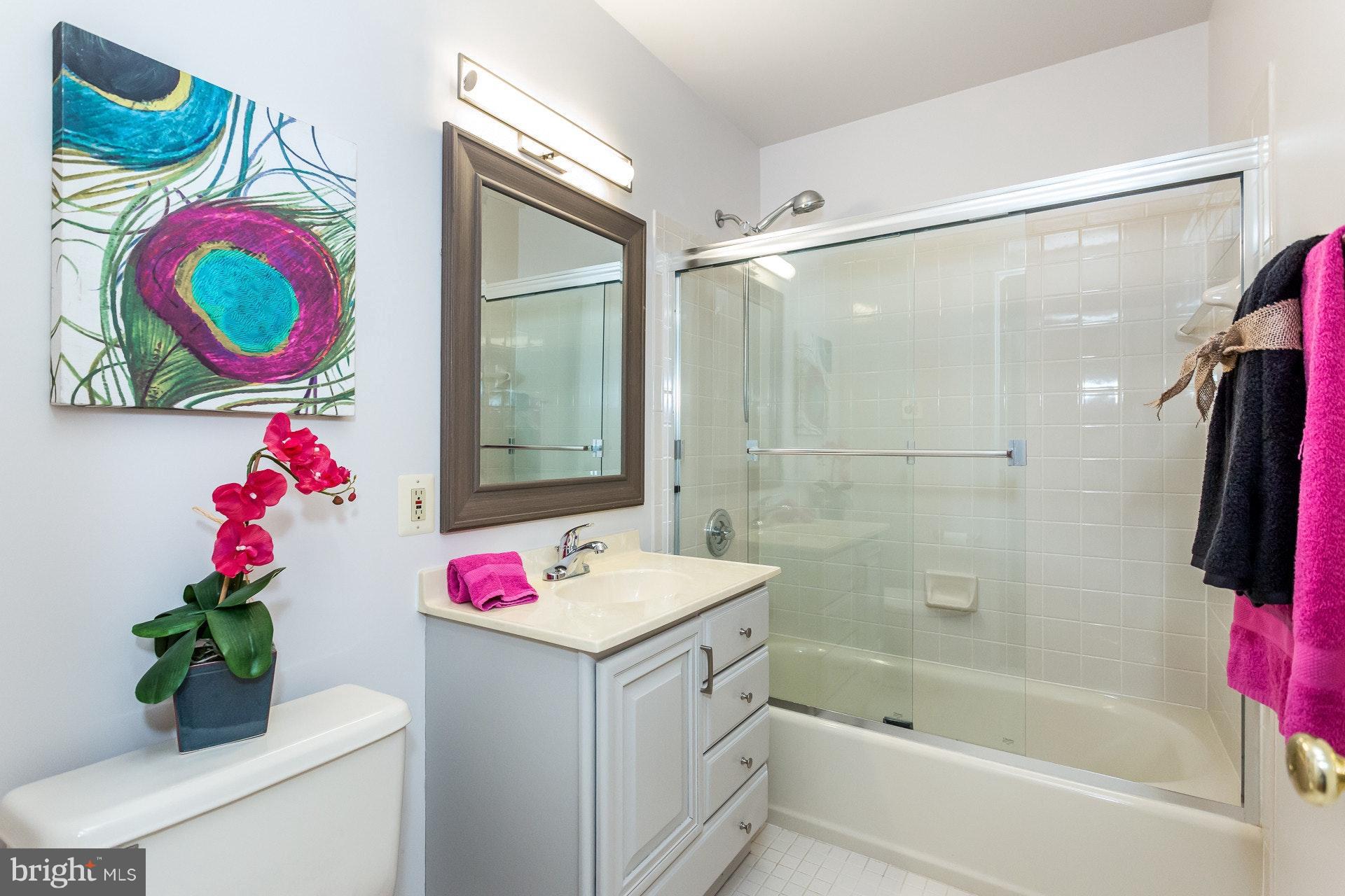 7204 Alger Road Falls Church, VA 22042 - Photo 23 of 30 Hall Bath with neutral tile and wood vanity