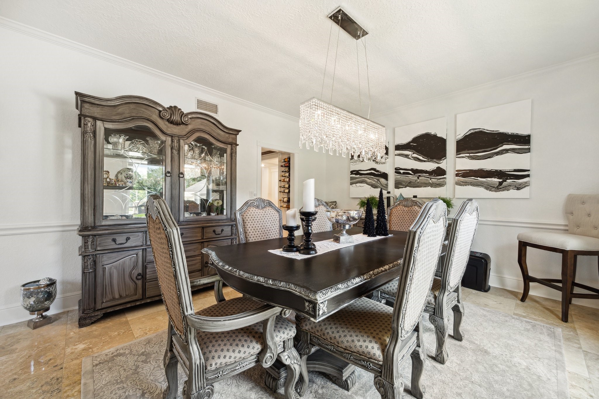 1917 Anchor Way Dickinson, TX 77539 - Photo 15 of 48 THE FORMAL DINING FEATURES DECORATIVE MOLDING AND A CUSTOM CHANDELIER