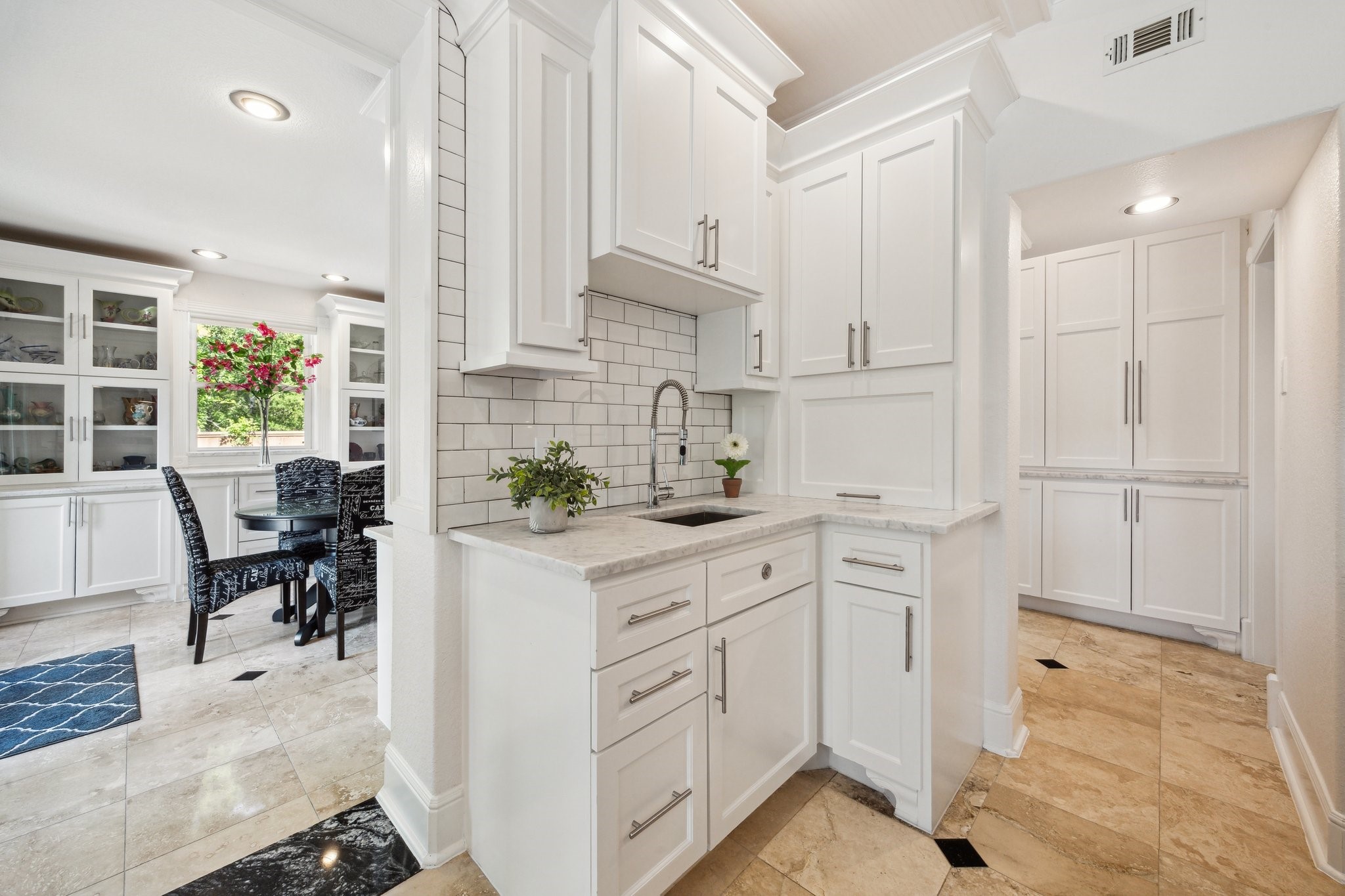 1917 Anchor Way Dickinson, TX 77539 - Photo 22 of 48 FULL COFFEE BAR SITS OFF OF THE BREAKFAST ROOM COMPLETE WITH A SINK AND, SUBWAY TILE AND CUSTOM GARAGE DOOR TO HIDE APPLIANCES