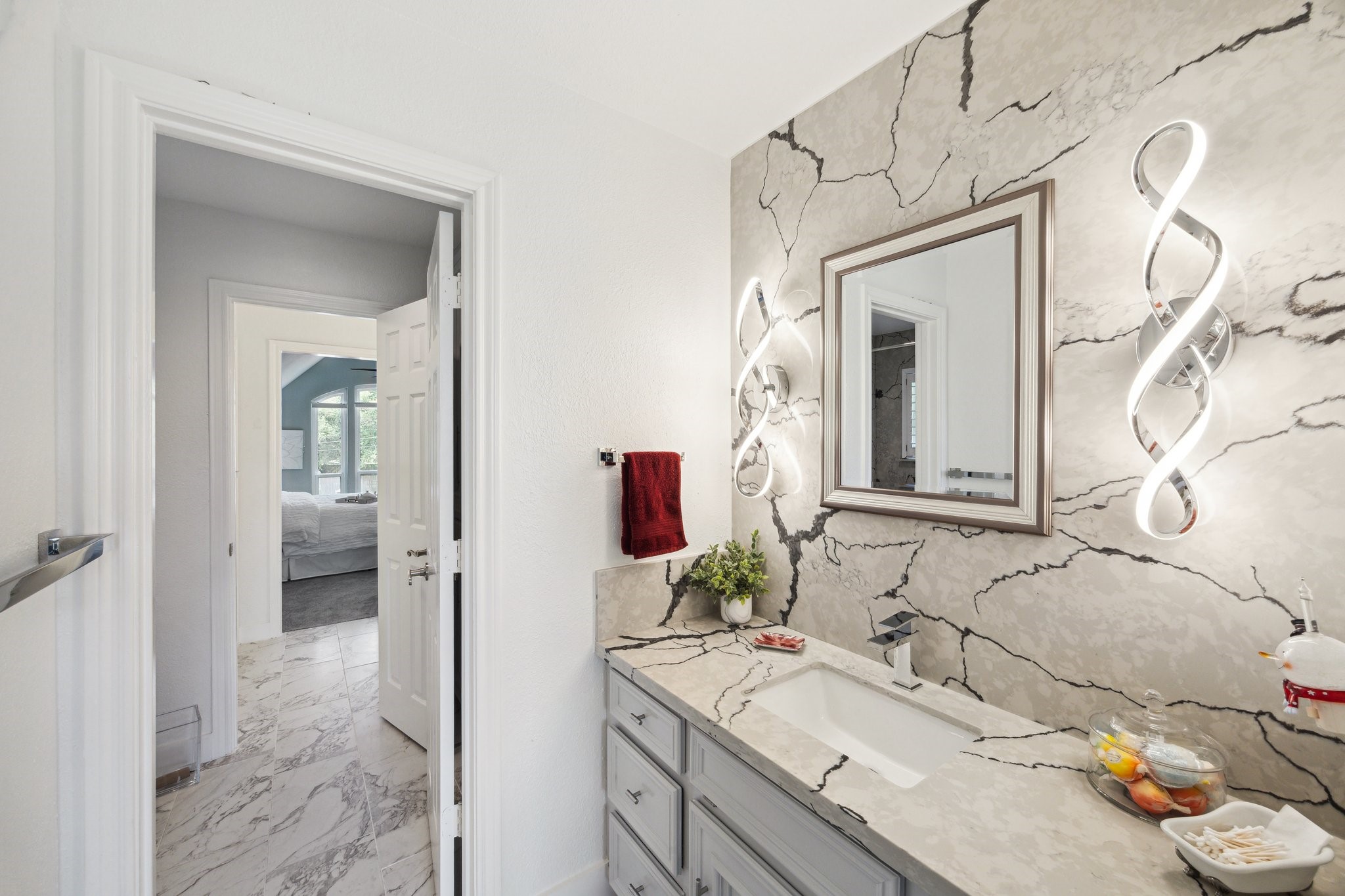 1917 Anchor Way Dickinson, TX 77539 - Photo 36 of 48 GORGEOUS QUARTZ COUNTERTOPS AND CONTEMPORARY LIGHTING IN BOTH VANITY AREAS EACH HAVING A WALK-IN CLOSET
