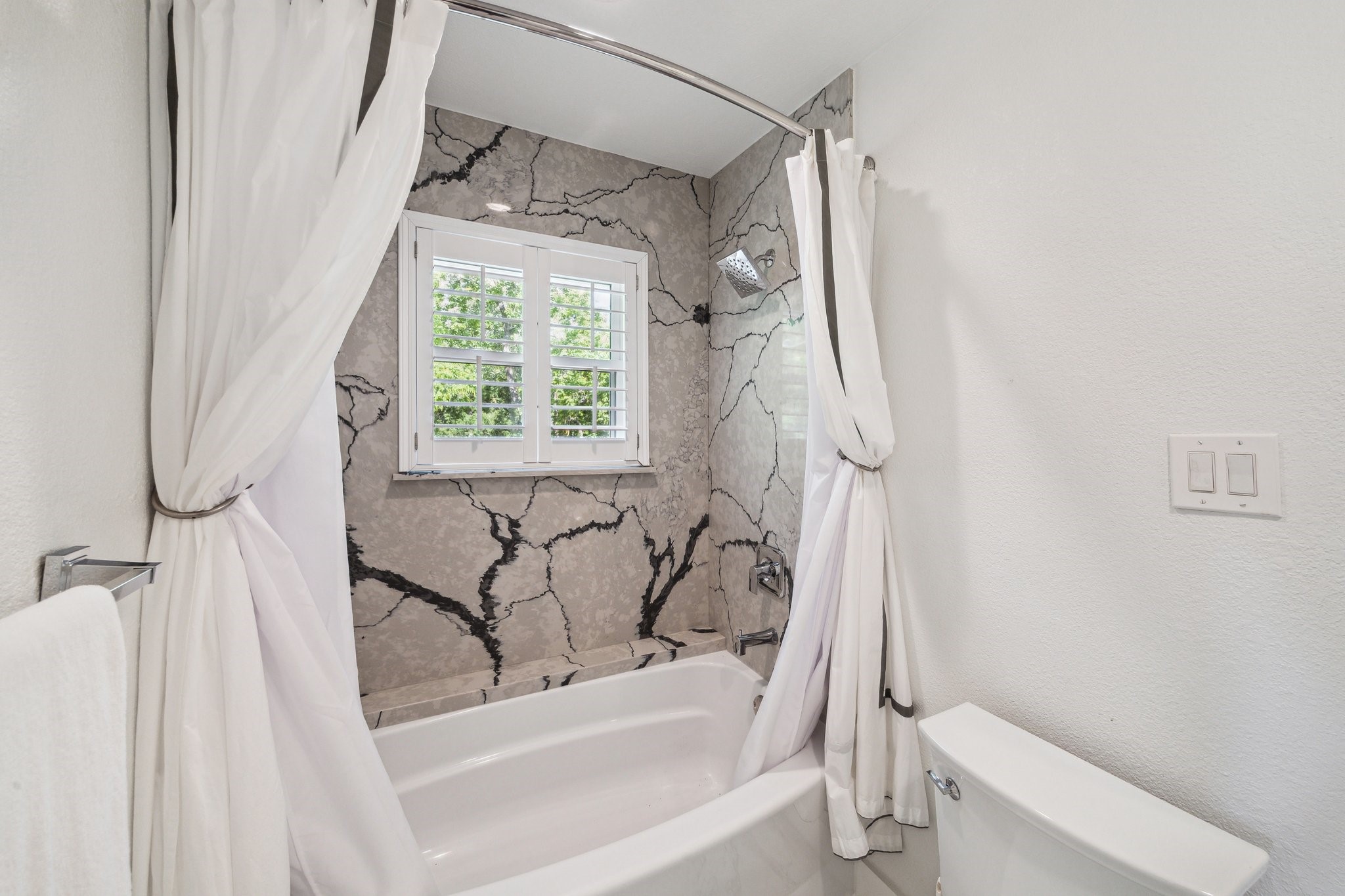 1917 Anchor Way Dickinson, TX 77539 - Photo 37 of 48 QUARTZ TILE ADORNS THE TUB/SHOWER WALL