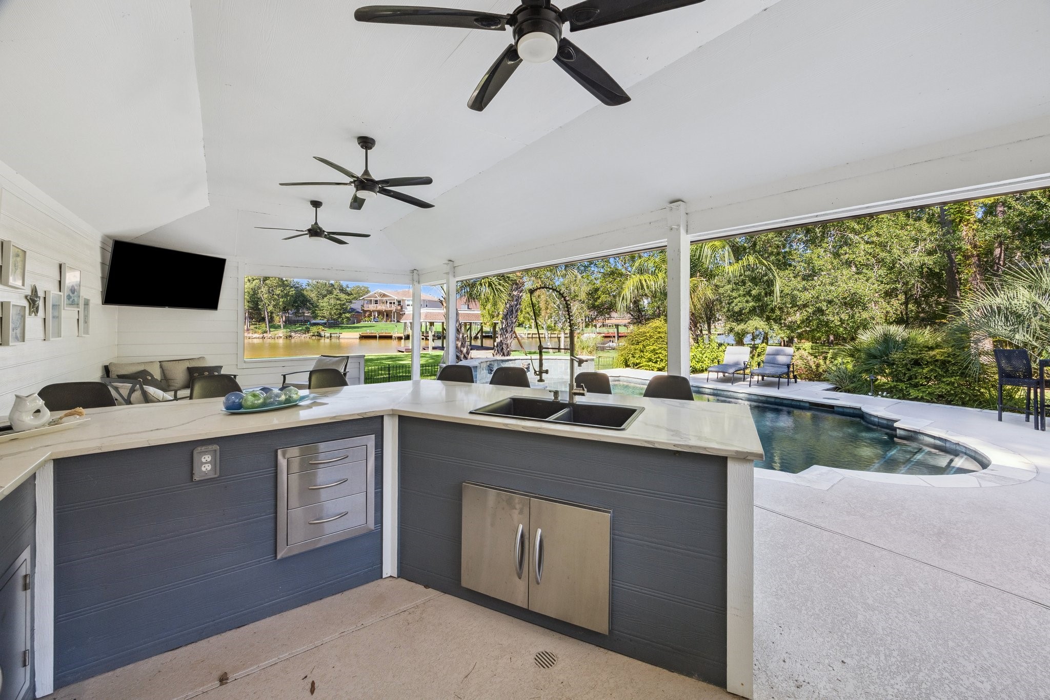 1917 Anchor Way Dickinson, TX 77539 - Photo 5 of 48 FULL OUTDOOR KITCHEN WITH RANGE, FRIDGE AND BBQ AREA