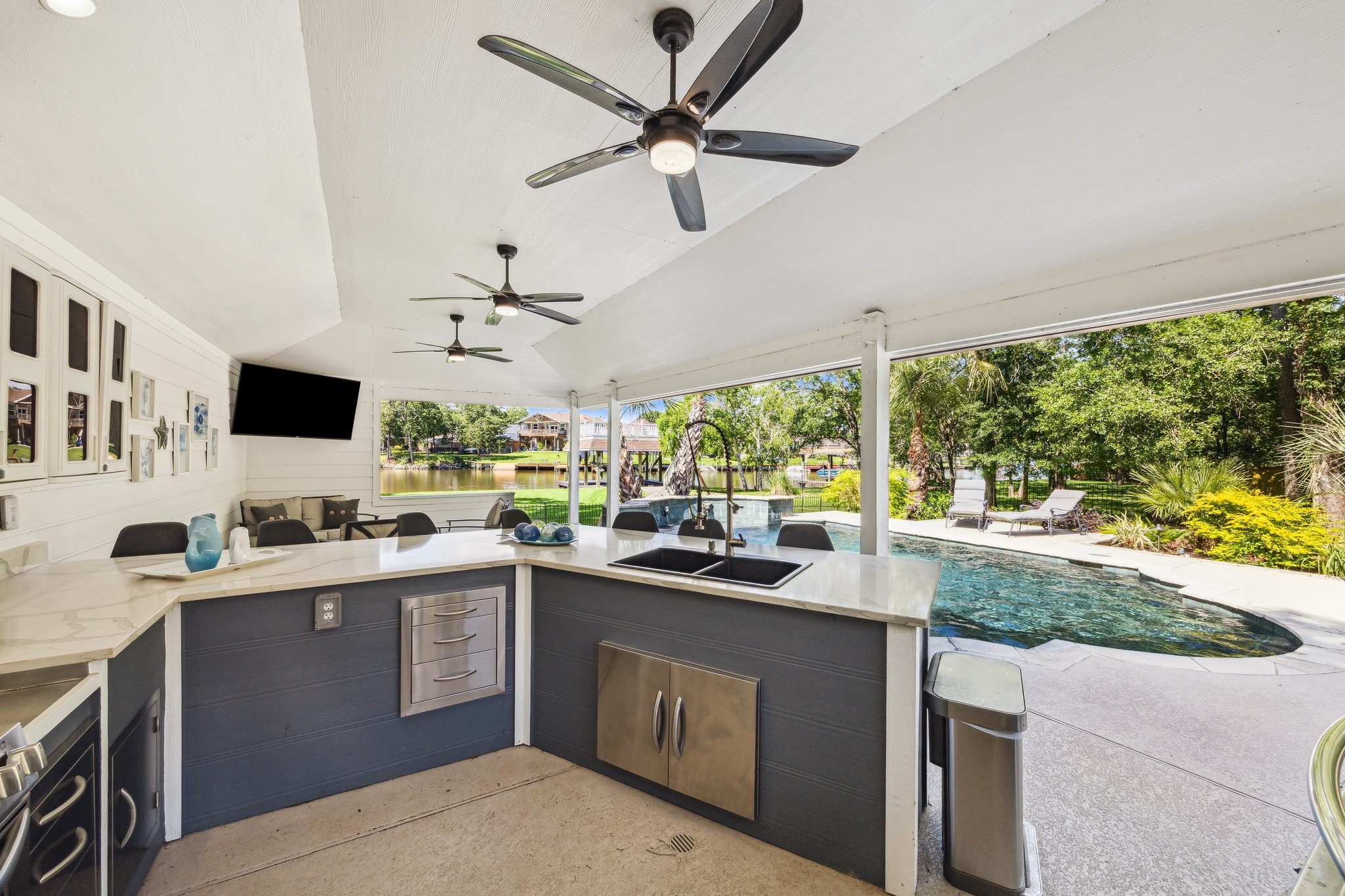 1917 Anchor Way Dickinson, TX 77539 - Photo 8 of 48 COMPLETE OUTDOOR KITCHEN WITH SEATED BAR AND A LOUNGE AREA OFFERS SO MUCH TO ENJOY WITH FRIENDS