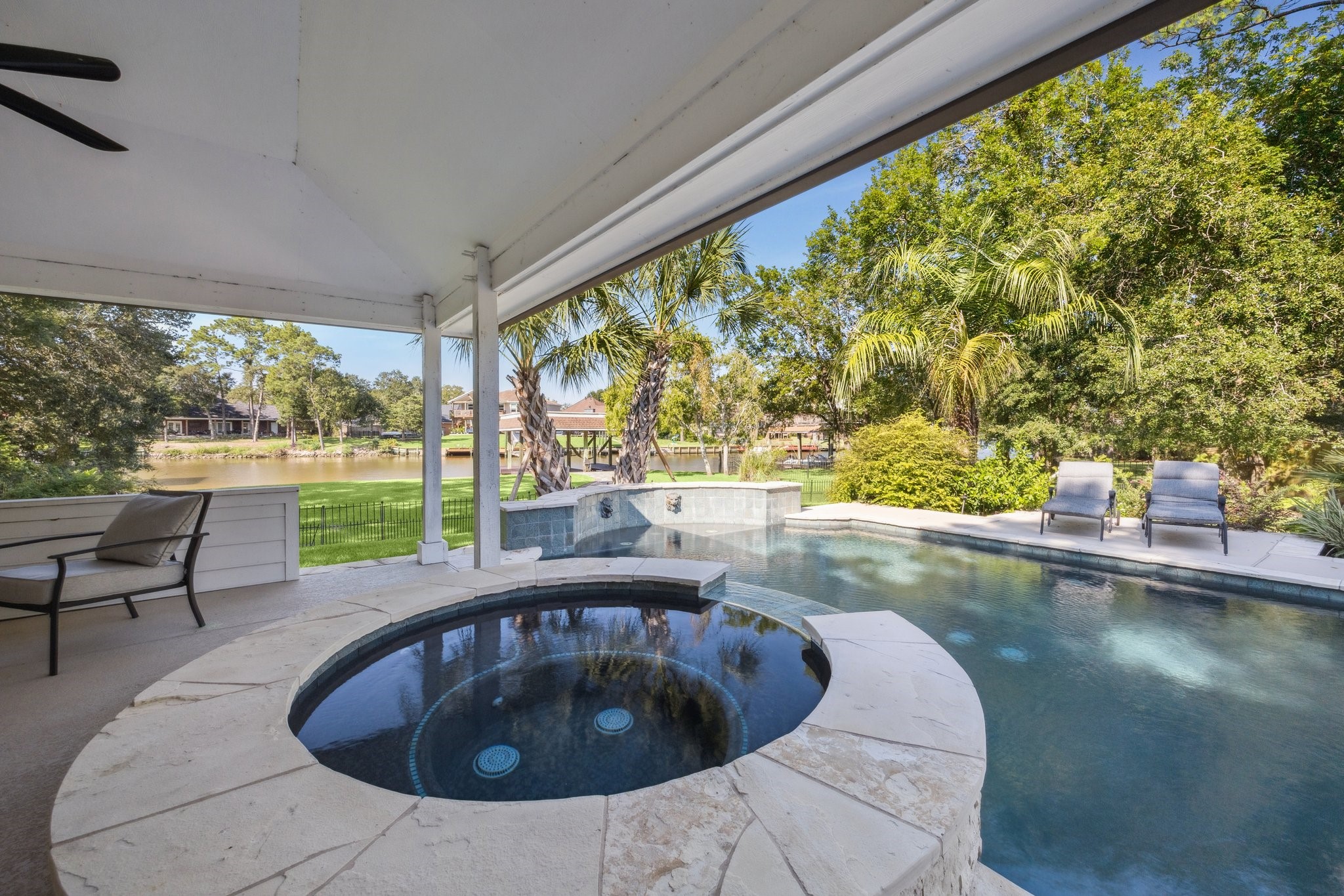 1917 Anchor Way Dickinson, TX 77539 - Photo 9 of 48 RELAX IN THE PARTIALLY COVERED SPA OVER LOOKING THE REFRESHING POOL AND GORGEOUS VIEW