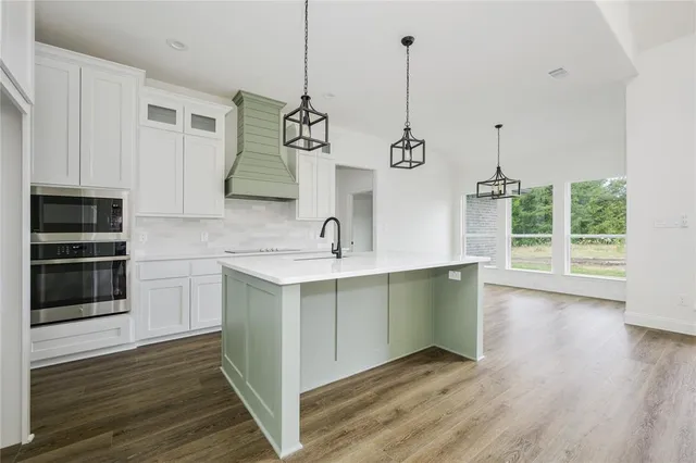 a view of a kitchen counter space a sink and dishwasher