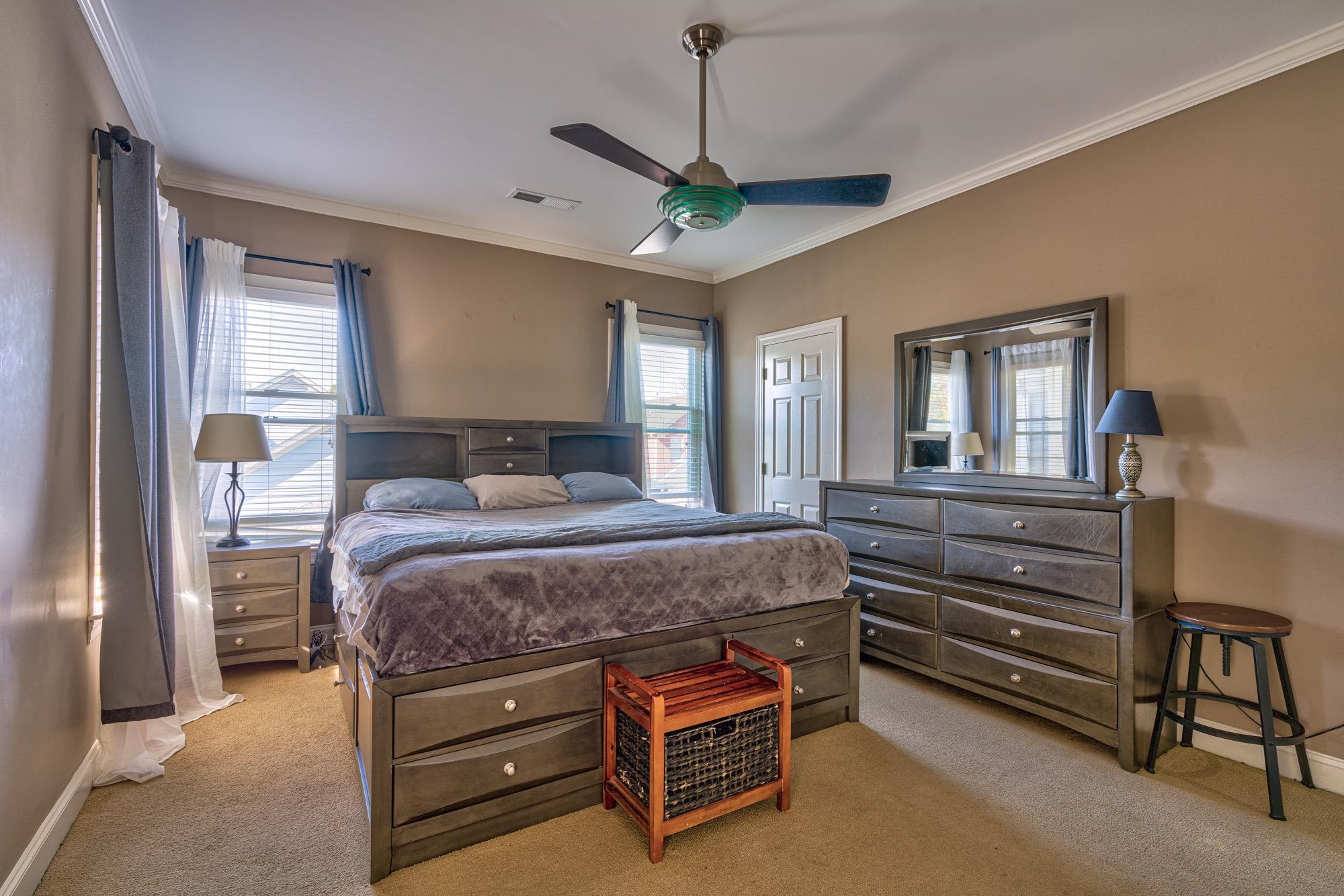 533 Rienzi Drive Memphis, TN 38103 - Photo 13 of 25 a bedroom with a bed and a chandelier