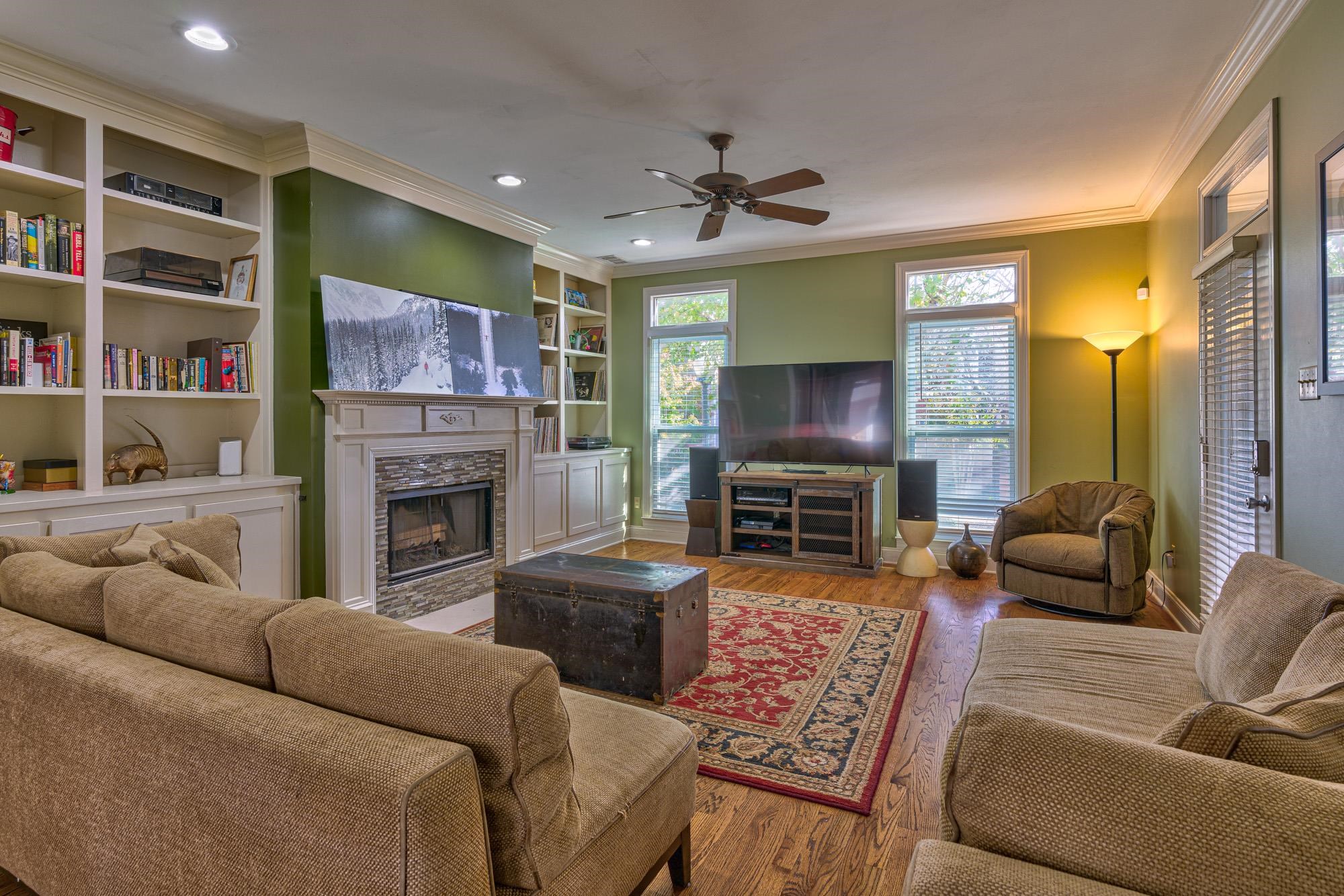 533 Rienzi Drive Memphis, TN 38103 - Photo 6 of 25 a living room with furniture a fireplace and a flat screen tv