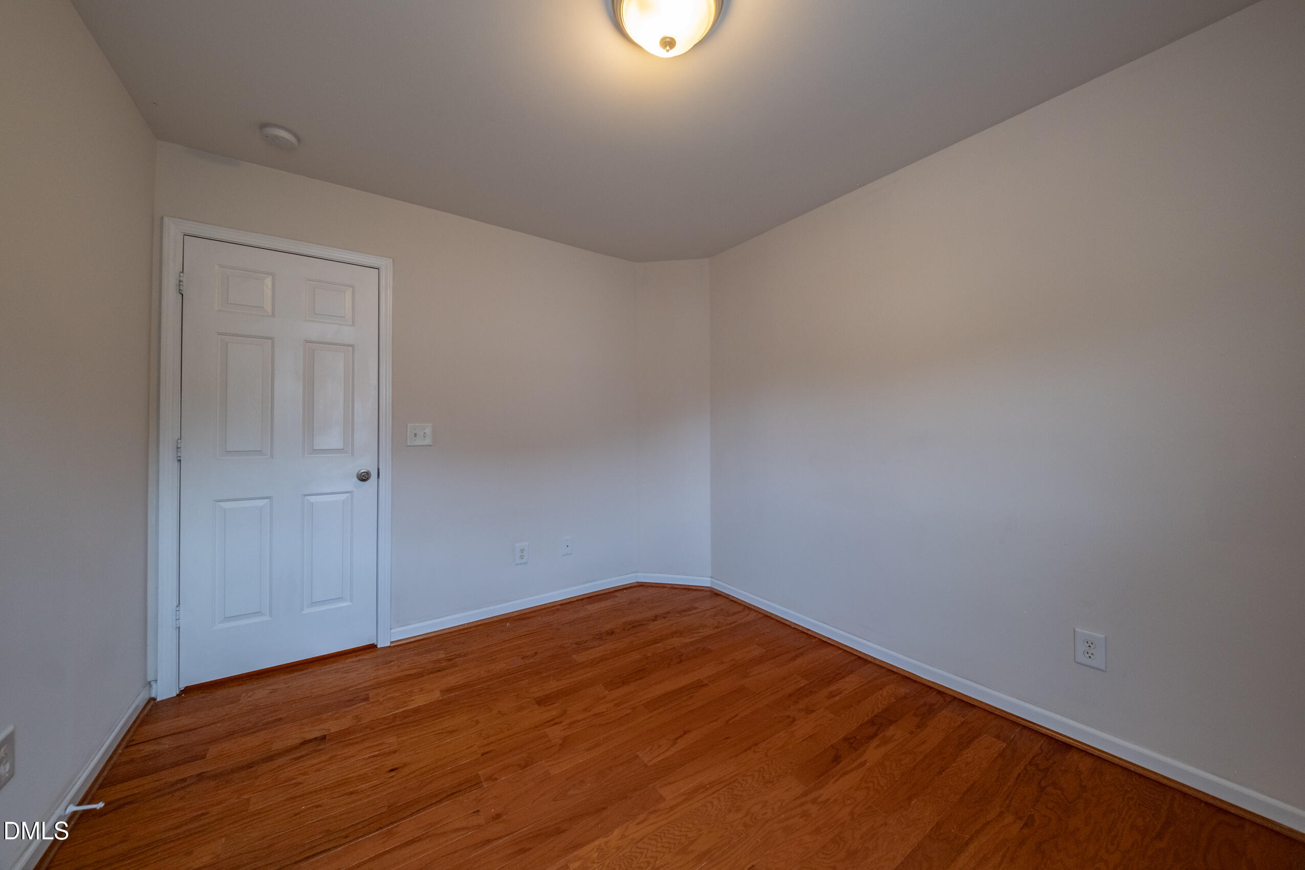 719 Obsidian Way Durham, NC 27703 - Photo 28 of 41 a view of empty room with wooden floor