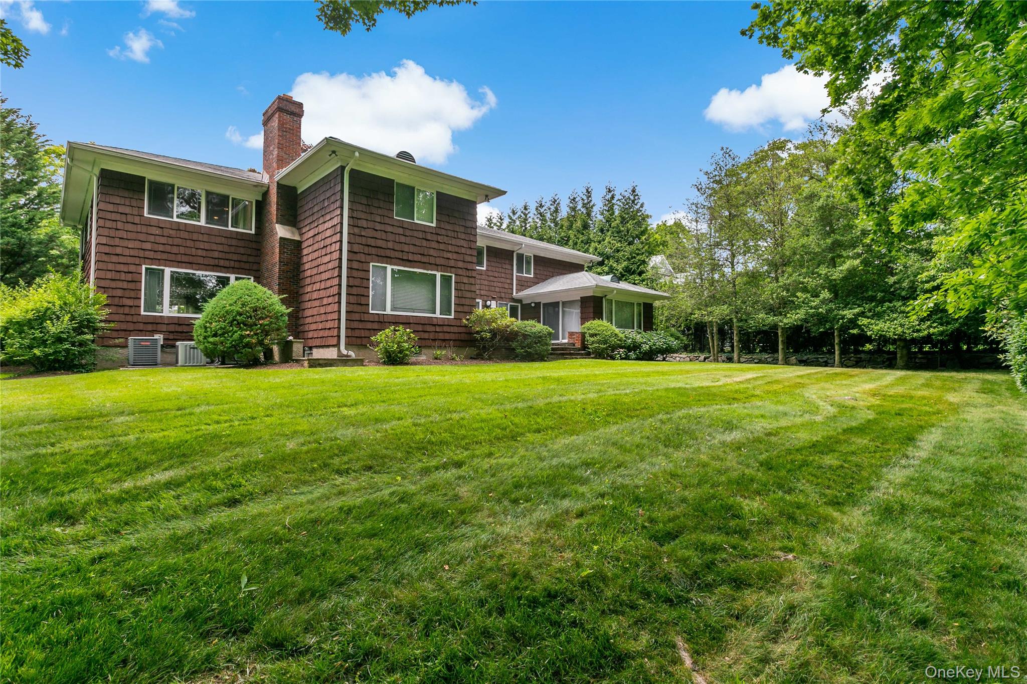 16 Meadow Road Scarsdale, NY 10583 - Photo 34 of 47 a front view of house with yard and green space