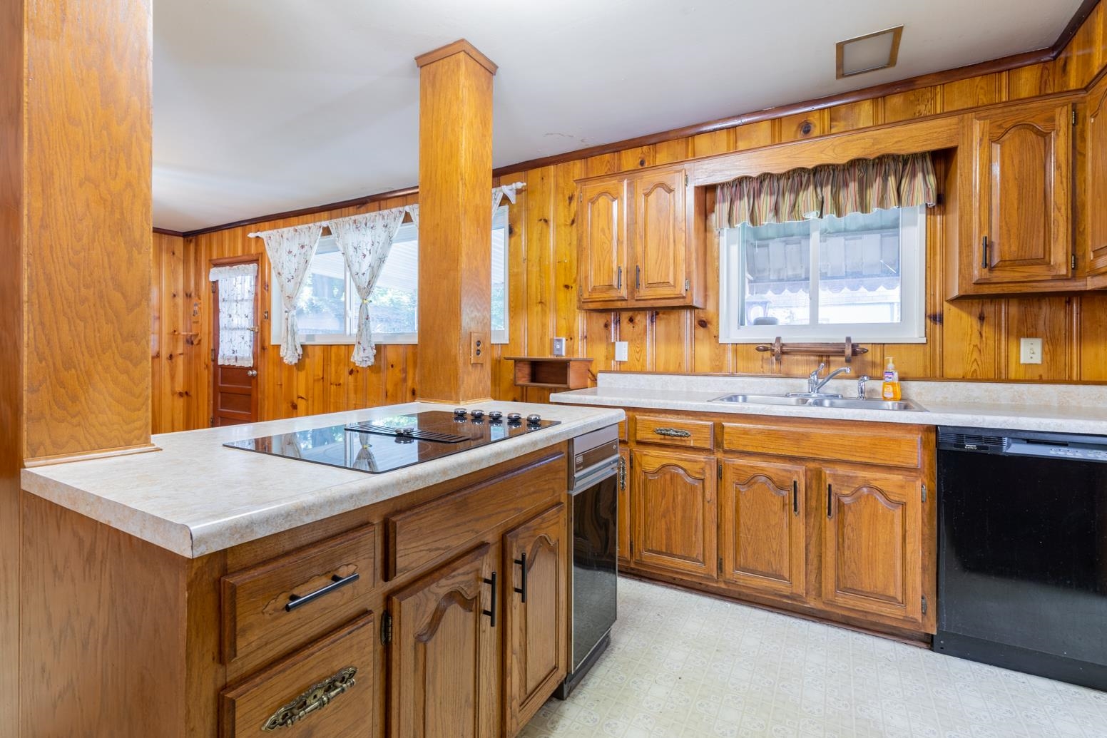 497 Fleda Road Memphis, TN 38120 - Photo 11 of 25 a kitchen with a sink stove and cabinets