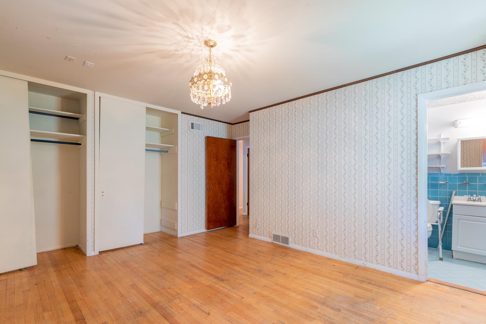 497 Fleda Road Memphis, TN 38120 - Photo 14 of 25 a view of an empty room with a chandelier