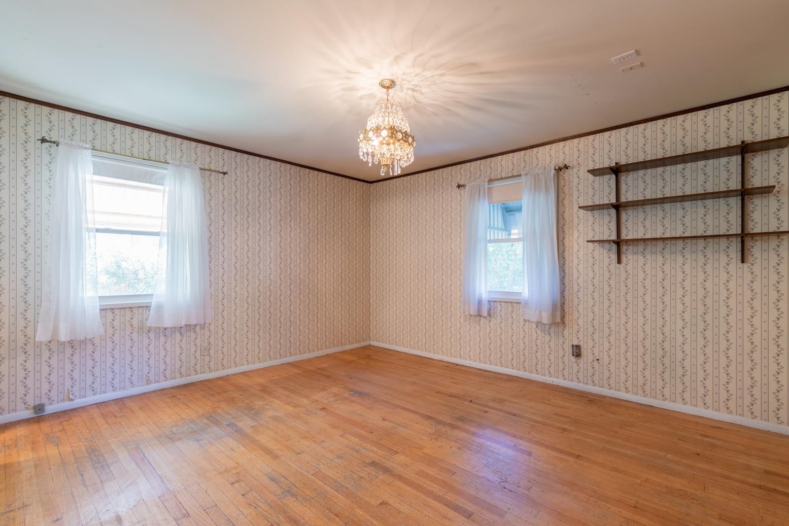 497 Fleda Road Memphis, TN 38120 - Photo 20 of 25 wooden floor in an empty room with a window