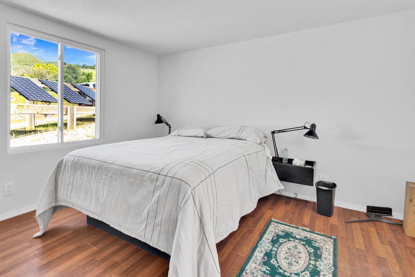 38483 Milpitas Road Greenfield, CA 93927 - Photo 41 of 55 a bedroom with a bed and a wooden floor